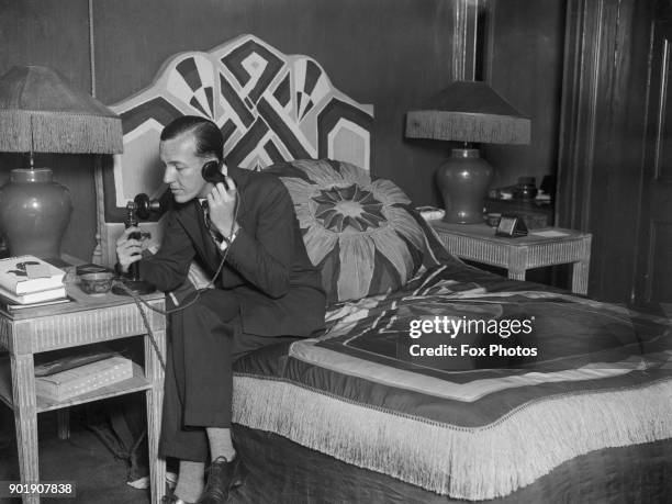 English writer, actor and director Noël Coward at home, September 1927.