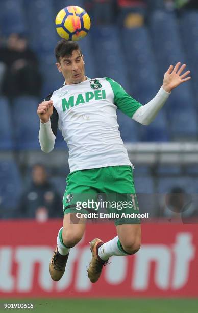 Federico Peluso of US Sassuolo Calcio jumps for the ball during the serie A match between Genoa CFC and US Sassuolo at Stadio Luigi Ferraris on...