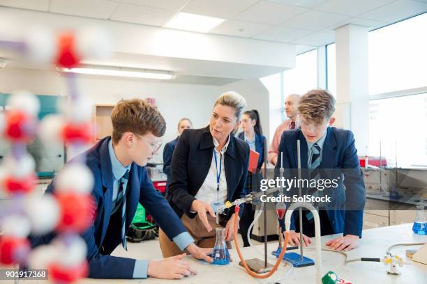 school children stem learning - student teacher uniform stock pictures, royalty-free photos & images