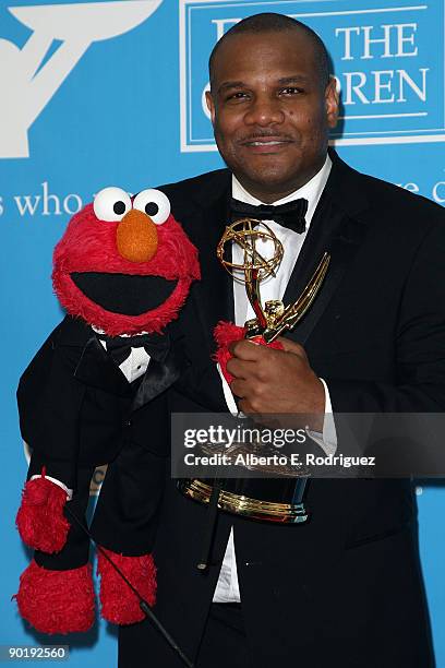 Actor/puppeteer Kevin Clash and Elmo pose in the press room during the 36th Annual Daytime Emmy Awards at The Orpheum Theatre on August 30, 2009 in...