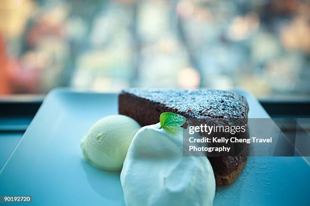 chocolate cake - whip cream dollop stock pictures, royalty-free photos & images