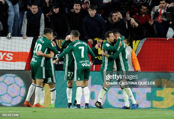 Real Betis' players celebrate a goal during the Spanish league football match between Sevilla and Real Betis at the Sanchez Pizjuan stadium in...