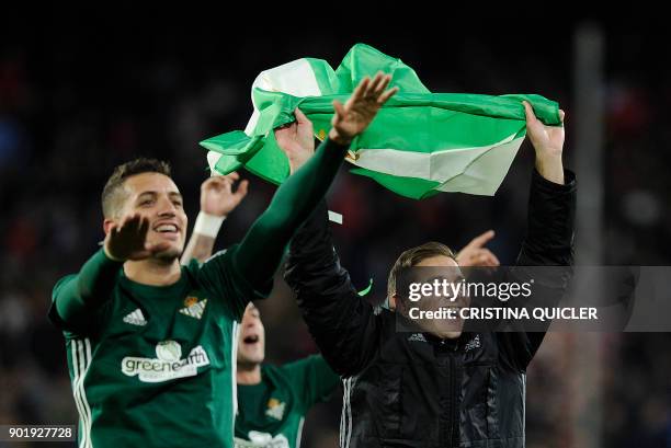 Real Betis' Moroccan defender Zou Feddal celebrates with Real Betis' Spanish midfielder Joaquin at the end of the Spanish league football match...