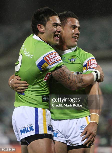 Daniel Vidot and Bronson Harrison of the Raiders celebrate after a try during the round 25 NRL match between the Canberra Raiders and the Newcastle...