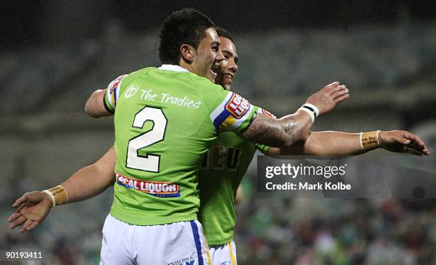 Daniel Vidot and Bronson Harrison of the Raiders celebrate after a try during the round 25 NRL match between the Canberra Raiders and the Newcastle...