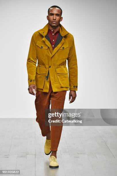 Model walks the runway at the Oliver Spencer Autumn Winter 2018 fashion show during London Menswear Fashion Week on January 6, 2018 in London, United...