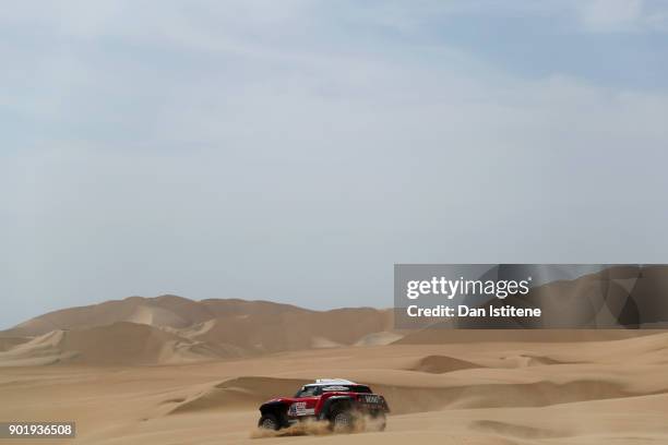 Mikko Hirvonen of Finland and Mini X-Raid drives with co-driver Andreas Schulz of Germany in the Mini John Cooper Works Buggy car in the Classe :...