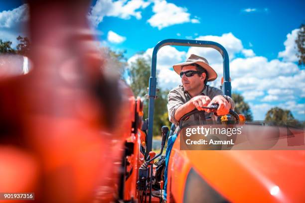 farmer working with harvester - farmer australia stock pictures, royalty-free photos & images