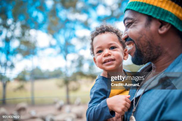 father and son - happy family in farm stock pictures, royalty-free photos & images