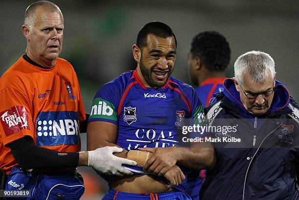 Zeb Taia of the Knights leaves the field with and injury during the round 25 NRL match between the Canberra Raiders and the Newcastle Knights at...