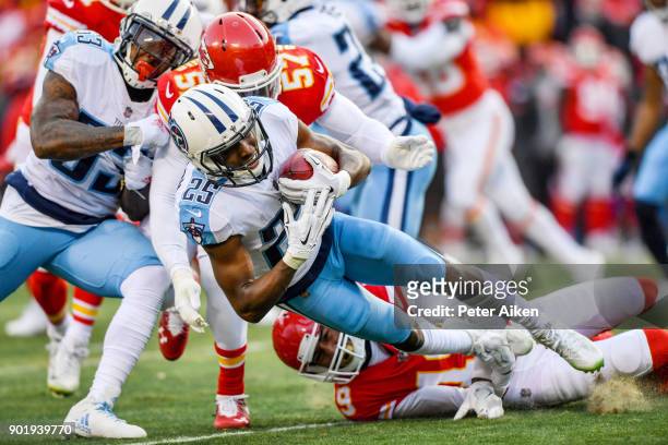 Cornerback Adoree' Jackson of the Tennessee Titans is tackled by linebacker Kevin Pierre-Louis and strong safety Daniel Sorensen of the Kansas City...