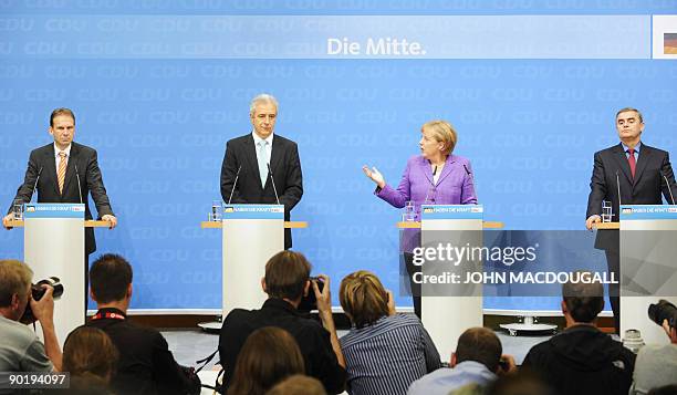 German Chancellor Angela Merkel Thuringia Premier Dieter Althaus , Saarland Premier Peter Mueller , and Saxony Premier Stanislav Tillich address a...