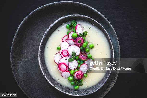 white soup with peas and radishes, close up - pea and mint soup stock pictures, royalty-free photos & images