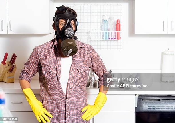 woman in vintage gas mask cleaning - gasmask bildbanksfoton och bilder