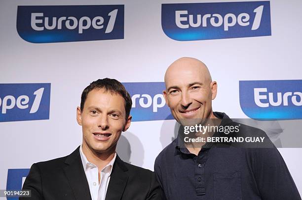 French humorist Nicolas Canteloup and journalist Marc-Olivier Fogiel pose during a press conference announcing the 2009/2010 programs of the radio...