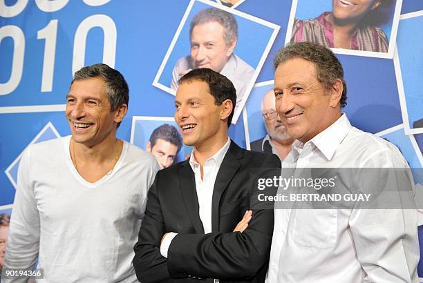 French anchorman Nagui , journalists Marc-Olivier Fogiel and Michel Drucker pose during a press conference announcing the 2009/2010 programs of the...