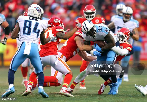 Tight end Delanie Walker of the Tennessee Titans is tackled after making a catch during the game against the Kansas City Chiefs at Arrowhead Stadium...