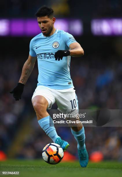 Sergio Aguero of Manchester City in action during The Emirates FA Cup Third Round match between Manchester City and Burnley at Etihad Stadium on...