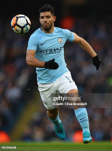 Sergio Aguero of Manchester City in action during The Emirates FA Cup Third Round match between Manchester City and Burnley at Etihad Stadium on...