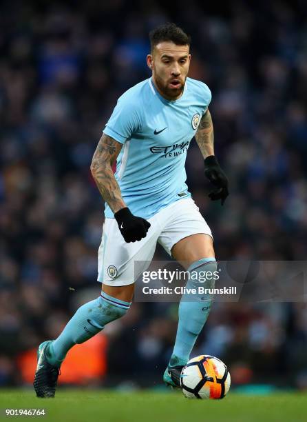 Nicolas Otamendi of Manchester City in action during The Emirates FA Cup Third Round match between Manchester City and Burnley at Etihad Stadium on...