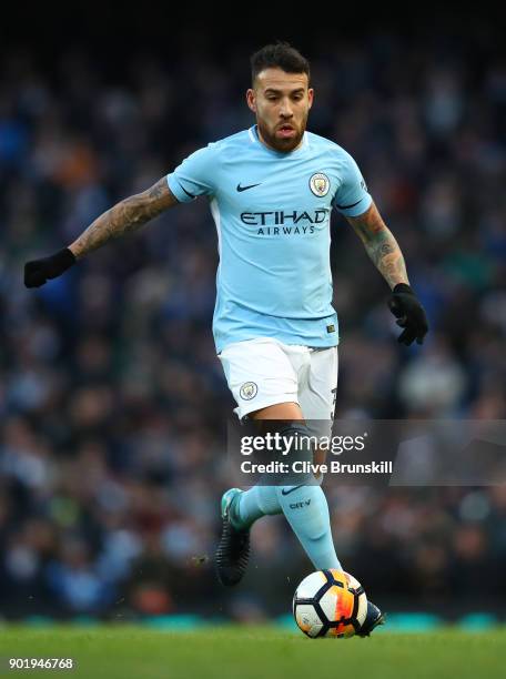 Nicolas Otamendi of Manchester City in action during The Emirates FA Cup Third Round match between Manchester City and Burnley at Etihad Stadium on...