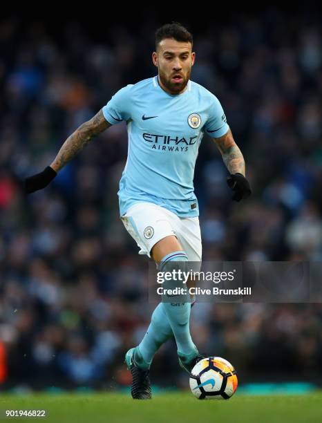 Nicolas Otamendi of Manchester City in action during The Emirates FA Cup Third Round match between Manchester City and Burnley at Etihad Stadium on...