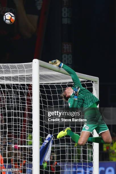 Christian Walton of Wigan Athletic tips the ball over the cross bar during the Emirates FA Cup Third Round match between AFC Bournemouth and Wigan...