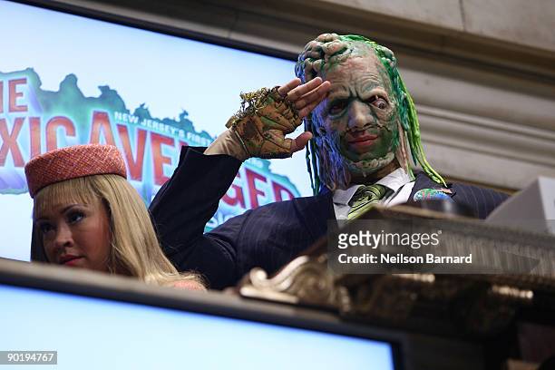 Members of the cast of "The Toxic Avenger" Diana DeGarmo and Nick Cordero ring the opening bell at the New York Stock Exchange on August 31, 2009 in...