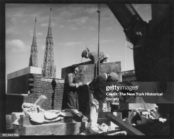 Radio City Music Hall construction, workers with St Patrick's visible in background, New York, New York, 1929.