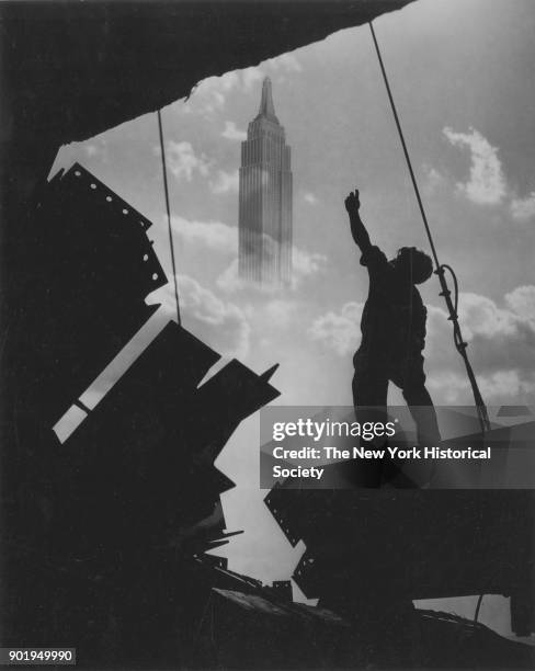 Salmon Tower, 500 Fifth Avenue, construction worker silhouetted, with Empire State Building superimposed, New York, New York, 1929.