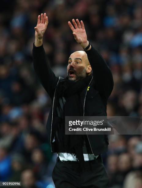 Josep Guardiola, Manager of Manchester City shows his emotion during The Emirates FA Cup Third Round match between Manchester City and Burnley at...