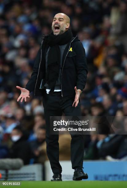 Josep Guardiola, Manager of Manchester City shows his emotion during The Emirates FA Cup Third Round match between Manchester City and Burnley at...