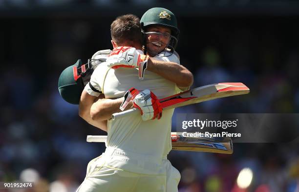 Shaun Marsh and Mitch Marsh of Australia celebrates after Shaun Marsh reached his century during day four of the Fifth Test match in the 2017/18...