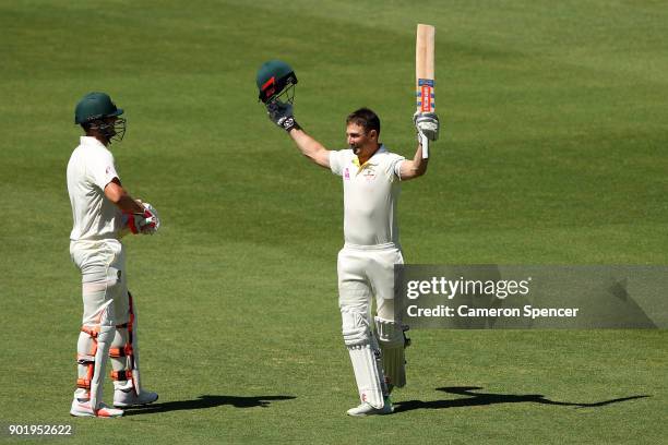 Shaun Marsh of Australia celebrates with his brother Mitch Marsh of Australia after reaching his century during day four of the Fifth Test match in...