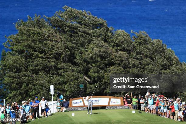 Dustin Johnson of the United States plays his shot from the 14th tee during the third round of the Sentry Tournament of Champions at Plantation...