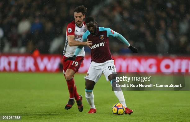 West Ham United's Arthur Masuaku and West Bromwich Albion's Jay Rodriguez during the Premier League match between West Ham United and West Bromwich...