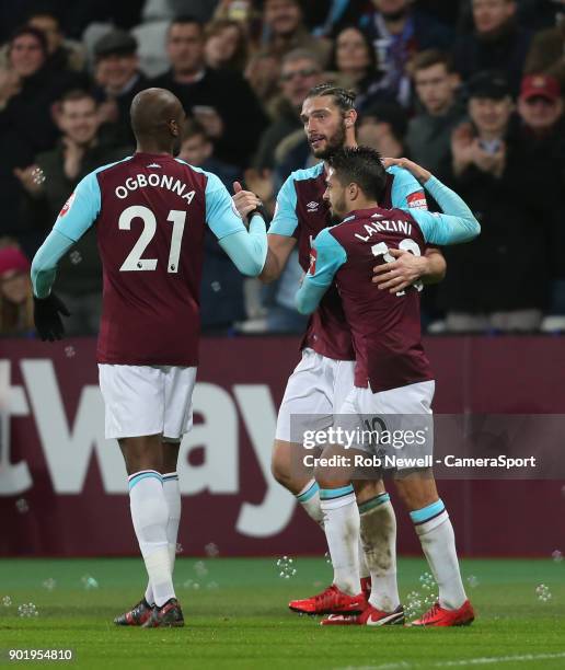 West Ham United's Andy Carroll is congratulated after scoring his side's 1st goal during the Premier League match between West Ham United and West...