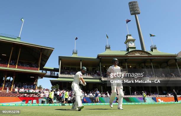 Shaun Marsh of Australia and Mitch Marsh of Australia walk out to bat during day four of the Fifth Test match in the 2017/18 Ashes Series between...