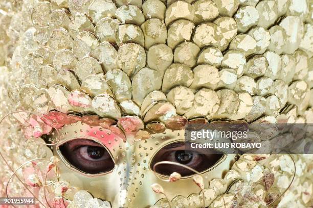 Reveller takes part in the "White Day" parade, on January 6 during the Carnival of Blacks and Whites in Pasto, Colombia, the largest festivity in the...