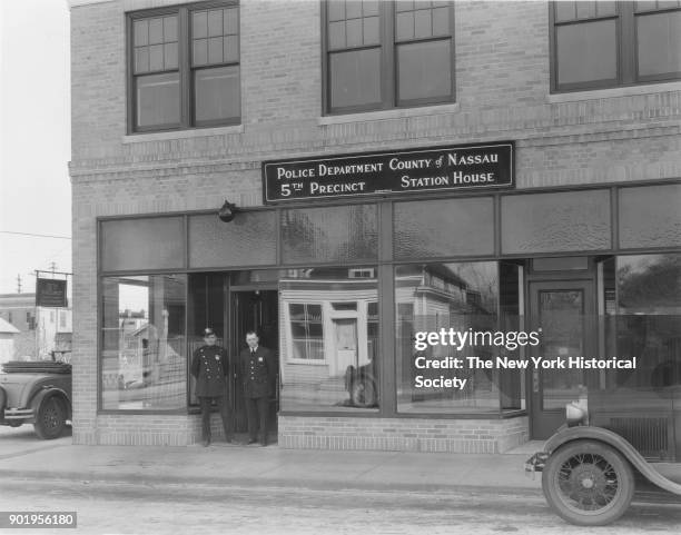 Exterior view, with officers in doorway, of Valley Stream Police Station, 5th Precinct, Nassau County, New York, 1929.