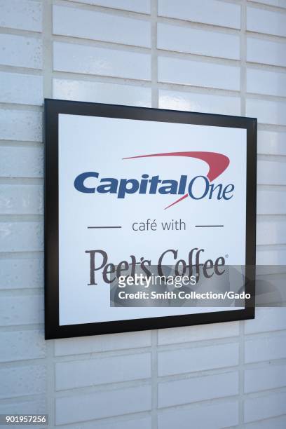 Sign advertising collaboration between CapitalOne bank and Peets Coffee at the CapitalOne Cafe, a combined cafe and banking center in downtown Walnut...