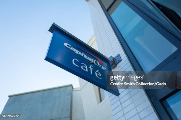 Sign with logo on facade of the Capital One Cafe, a combined banking center and cafe in downtown Walnut Creek, California, November 17, 2017.