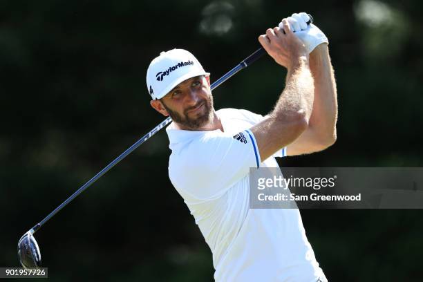 Dustin Johnson of the United States plays his shot from the 18th tee during the third round of the Sentry Tournament of Champions at Plantation...
