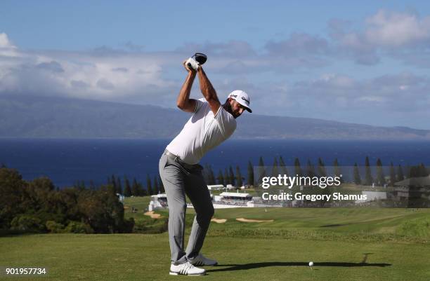 Dustin Johnson of the United States plays his shot from the 18th tee during the third round of the Sentry Tournament of Champions at Plantation...