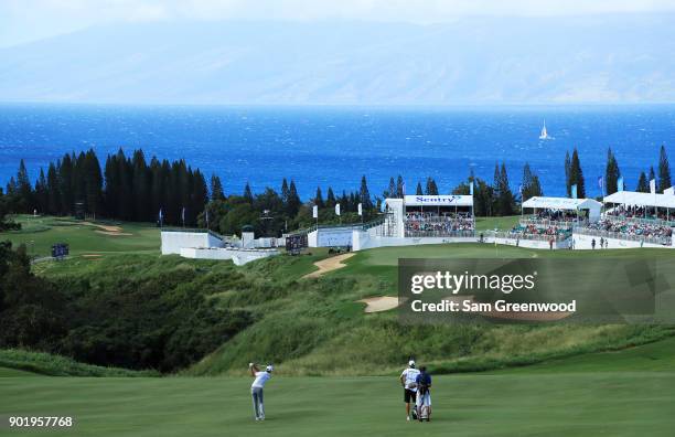 Dustin Johnson of the United States plays a shot on the 18th hole during the third round of the Sentry Tournament of Champions at Plantation Course...