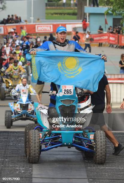 Maxim Antimirov from Kazakistan is pictured on the podium during the start of the 2018 Dakar Rally, ahead of the rally's Lima-Pisco Stage 1, in Lima...