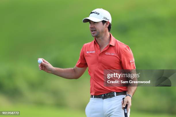 Brian Harman of the United States reacts on the 18th green during the third round of the Sentry Tournament of Champions at Plantation Course at...