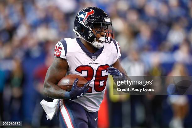 Lamar Miller of the Houston Texans runs with the ball against the Indianapolis Colts during the first half at Lucas Oil Stadium on December 31, 2017...