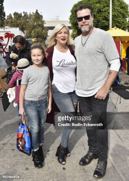 Actors Tori Spelling, Dean McDermott and daughter pose for portrait at the premiere of Warner Bros. Pictures' "Paddington 2" After Party on January...