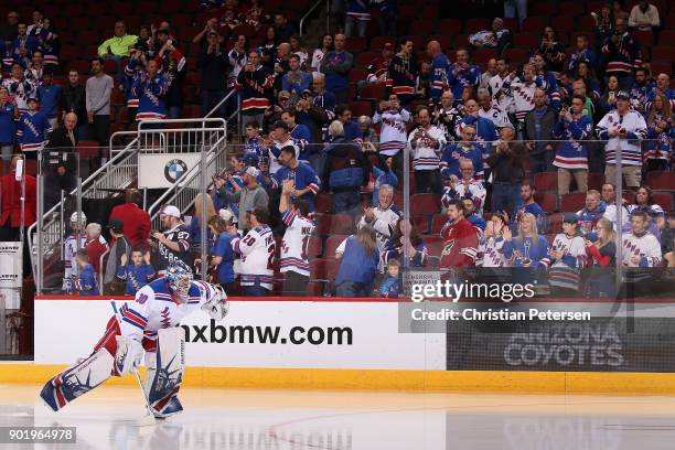 Goaltender Henrik Lundqvist of the New York Rangers skates out onto the ice for warm ups before the NHL game against the Arizona Coyotes at Gila...